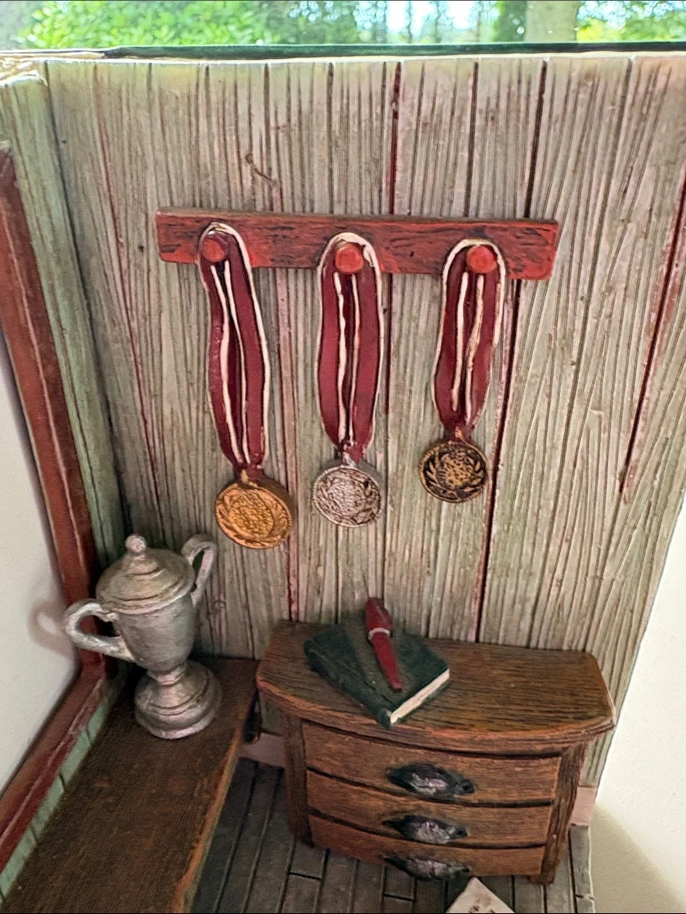 Picture frame decoration with open book and awards